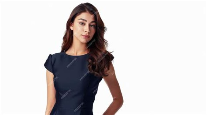 Pretty Lady in Cute Green Dress Dances Buga With Walkie Talkie in Front of Big Mansion, Fine Video Causes Stir